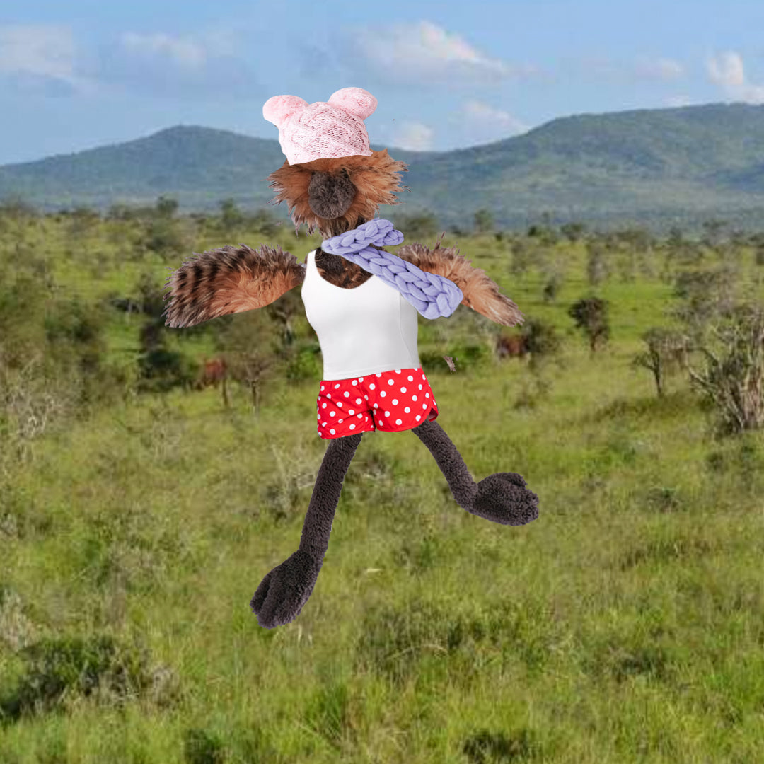 child's plush stuffed ostrich in red shorts, white tank top, lavender knitted scarf, and pink double pompon hat, running in the savanna.